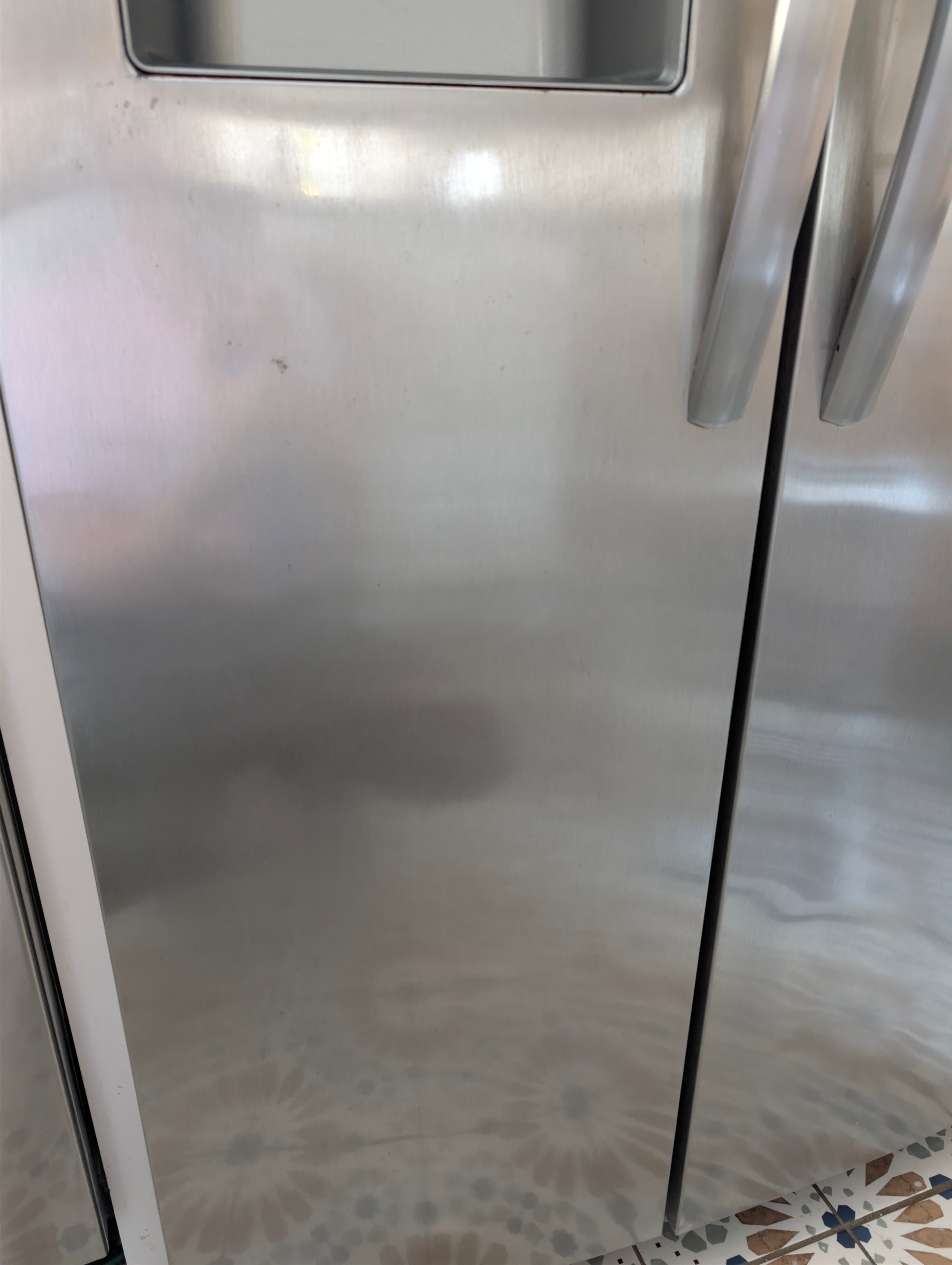 Spotless stainless steel fridge after YassClean