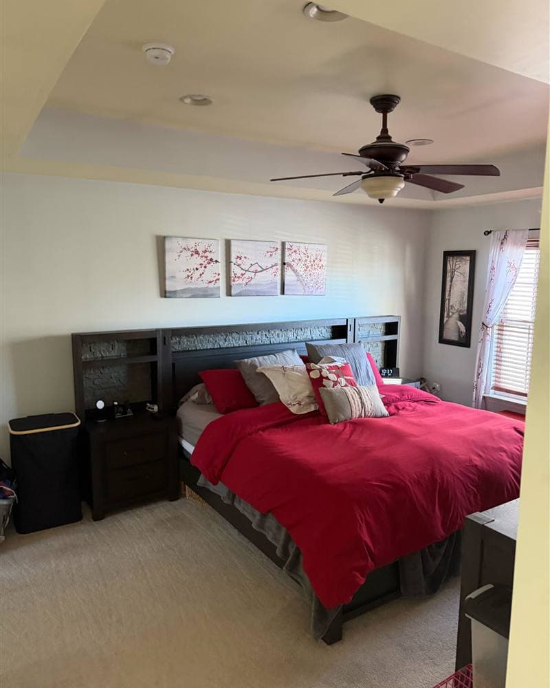 A neatly made master bedroom with styled bedding, tidied during a New Jersey house cleaning visit.