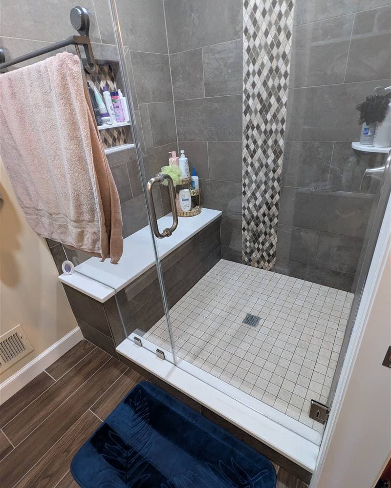 Clean glass and tile walk-in shower after a house cleaning in Hamburg, NJ