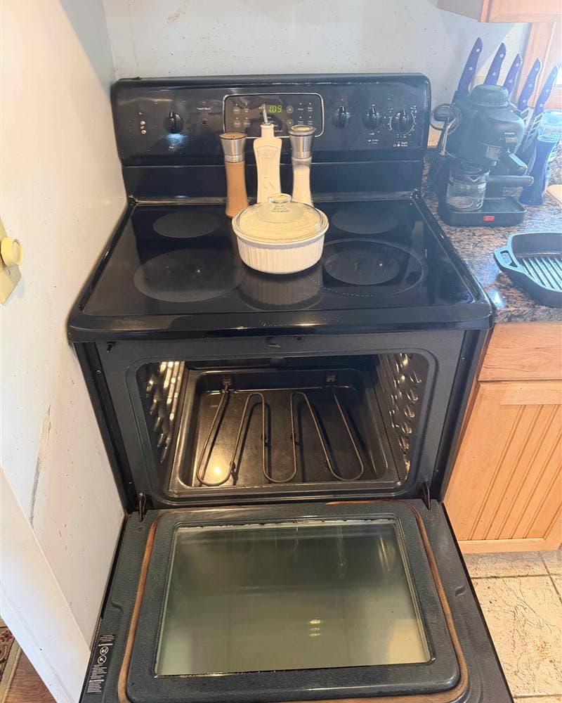 Polished stovetop and cleaned oven interior after a deep clean in Sparta, NJ